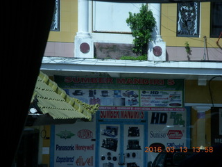358 99d. Indonesia - Bali - bus ride - monument - technology store