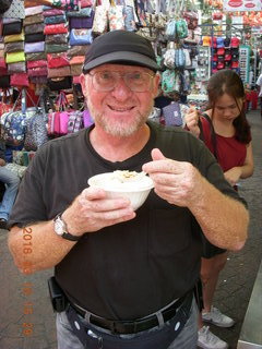 68 99g. Malaysia - Kuala Lumpur food tour - Chinese temple - Adam eating sweet tofu