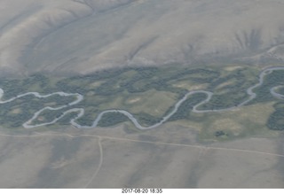 116 9sl. aerial - Riverton to Rock Springs - winding river in wide wash