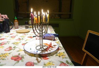 eight lit candles in menorah