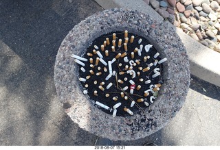 lots of cigarettes in the ashtray