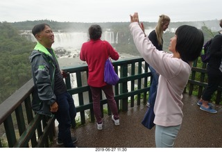 151 a0e. Iguazu Falls + Peter and Regina Lee taking a picture