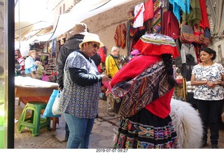 Peru - drive to cusco - market - llama girl