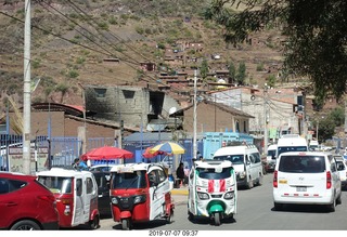 Peru - drive to cusco - market - three wheelers