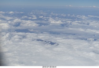 110 a0f. aerial - Peru - flight from Cusco to Lima - Andes Mountains - cumulus granite clouds