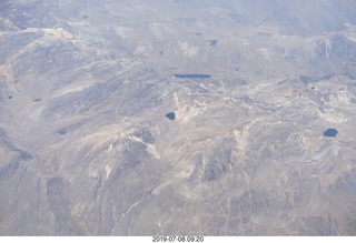 aerial - Peru - flight from Cusco to Lima - Andes Mountains - many colored rocks (painted desert like)