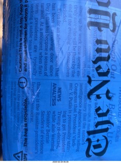 New York Times through blue plastic bag