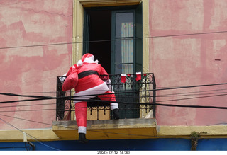 201 a0y. Argentina - Buenos Aires tour - santa climbing into a balcony