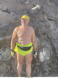 Adam shirtless atop North Mountain hike