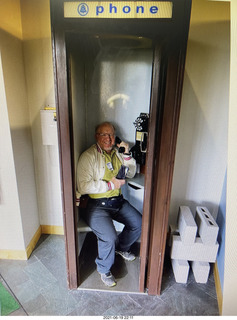 Adam in phone booth at Middletown AT&T museum