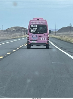 23 a18. drive to Marble Canyon - pink Grand Canyon Tours bus