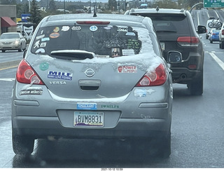 drive on Route 89 to Flagstaff - snow and stickers on a car