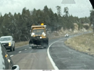 drive on Route 89 to Flagstaff - snowplow in mirror