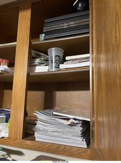 shelf with puzzles hidden behind stuff