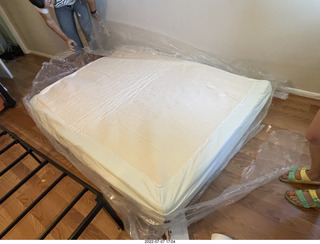 home construction - mattress coming out of the box