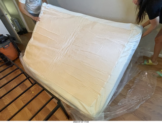 home construction - mattress coming out of the box