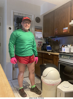 Adam dressed for bicycling in red and green for Christmas