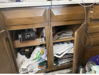 cat Potato hiding in my cabinet