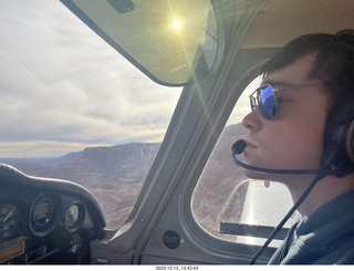 146 a20. Tyler flying N8377W with sunglasses