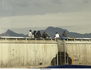 7 a24. Torreon - Mexicans riding the tops of freight-train cars