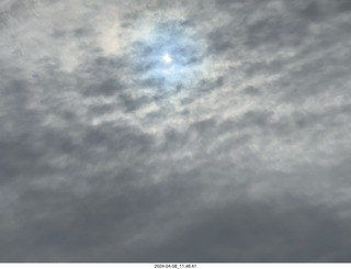 Torreon eclipse day - partial eclipse through clouds, attempt by iPhone