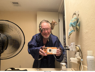 Ashley Saenz and cat Pickle on her back