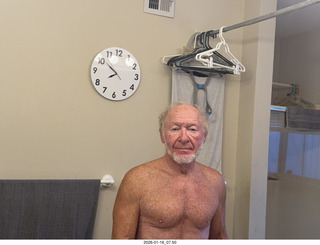 Adam nearly nude with my new bathroom mirror clock