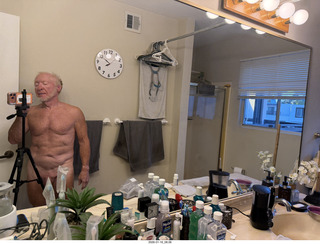 Adam nearly nude and bathroom mirror clock