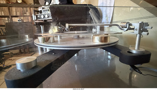 11 a2u. Transcriptor Skeleton turntable and Vestigal tonearm with clear vinyl record