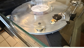 12 a2u. Transcriptor Skeleton turntable and Vestigal tonearm with clear vinyl record