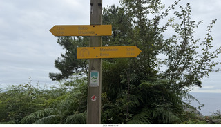 36 a2y. Spain - Bilbao wine tour - seaside viewpoint - directions sign